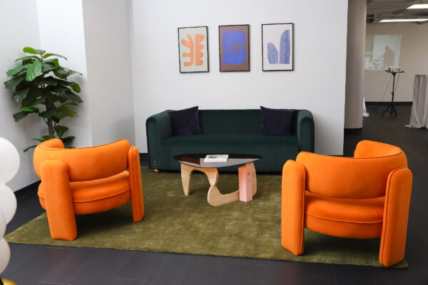 lounge room with one couch, two chairs, and a coffee table.